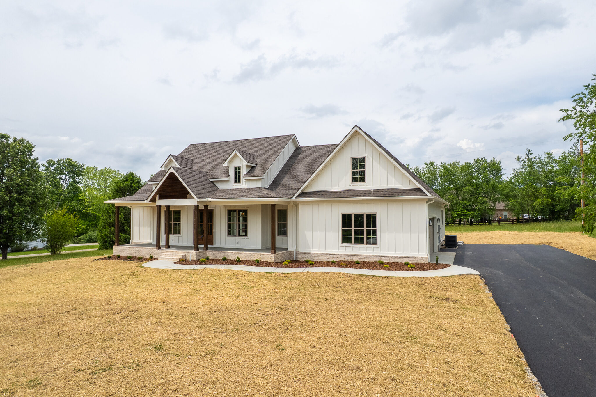 Completed Six Arrows custom home viewed from the front drive